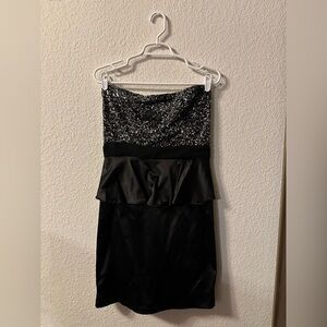 Short black dress with sequin bust area